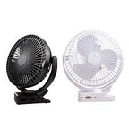 Rechargeable mini fan with clip used outdoors for travel camping and summer cooling
