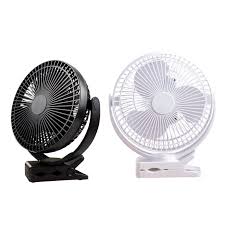 Rechargeable mini fan with clip used outdoors for travel camping and summer cooling